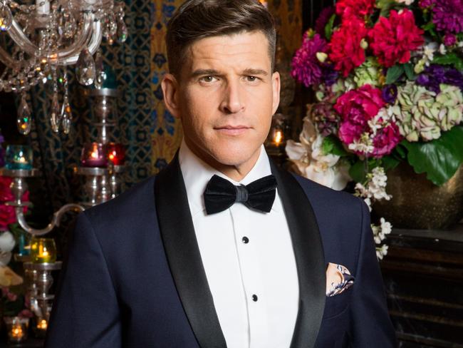 Osher Günsberg poses for a portrait ahead of the new series of The Bachelor.