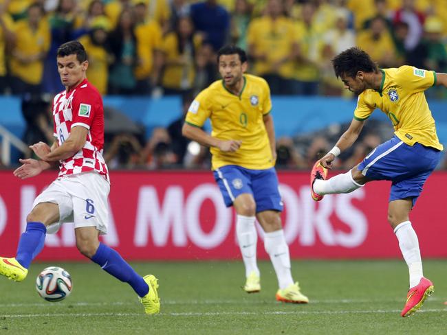 Brazil's Neymar, right, shoots from long range to score his side’s first goal against Croatia.