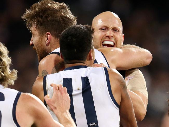 Round 18. 21/07/2018. Geelong v Melbourne at the GMHBA, Geelong.  Geelong's Zach Tuohy is hugged by Gary Ablett after he goaded after the siren giving the cats a 4 point win   . Pic: Michael Klein