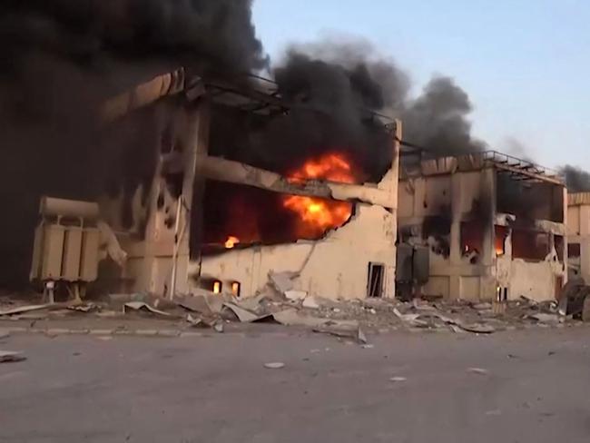 Buildings burn following Israeli strikes on the Ras Kutaib power station in Hodeida. Picture: Al-Masirah TV/AFP