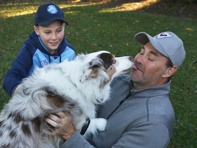 Leo (left) and Luke Durman are reunited with Bowie. Picture: Toni Fuller Imagery