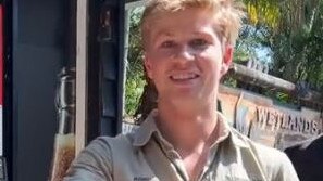 Robert Irwin rescues a snake from a venting machine. Picture: Tiktok