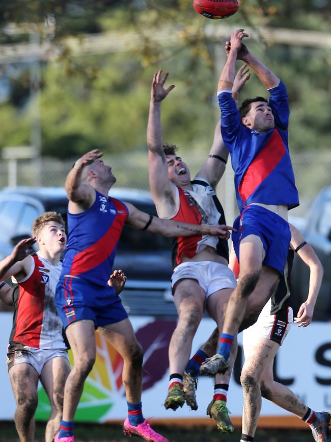 Koroit’s Matthew Bradley is outnumbered in this marking contest.