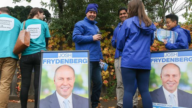 MELBOURNE, AUSTRALIA- NewsWire Photos MAY 14 2022,  Josh Frydenberg hands out how to vote leaflets and meets with early voters as he attends a voting centre in the seat of Kooyong.Picture: NCA NewsWire /Brendan Beckett