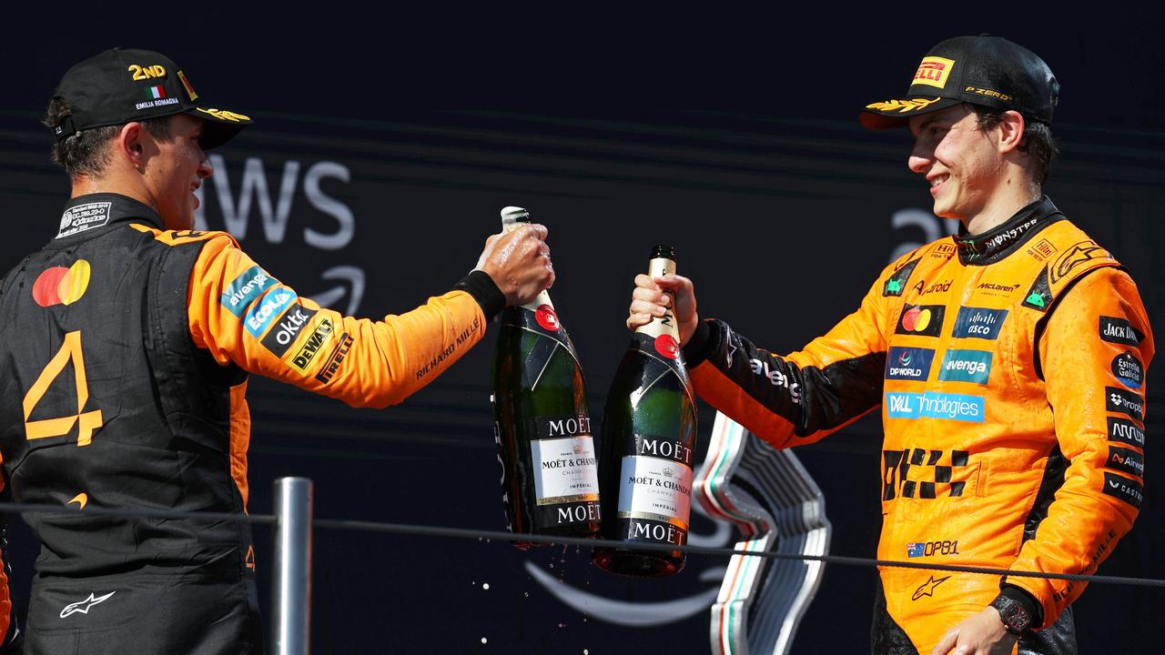 Second placed Lando Norris (L) and McLaren teammate Oscar Piastri (third) celebrate their podium finishes. Picture: Getty