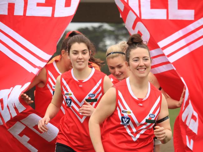 Red Hill players run onto the ground last season. Picture: Liz Harris