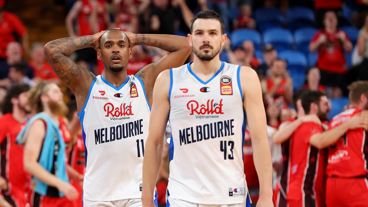 Xavier Rathan-Mayes and Chris Goulding of Melbourne United look on dejected.