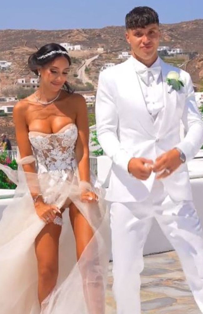 The bride wore a strapless lace gown but the windy weather opened her ultra-high split and exposed her underwear while walking down the aisle. Picture: TikTok/ScarletVas