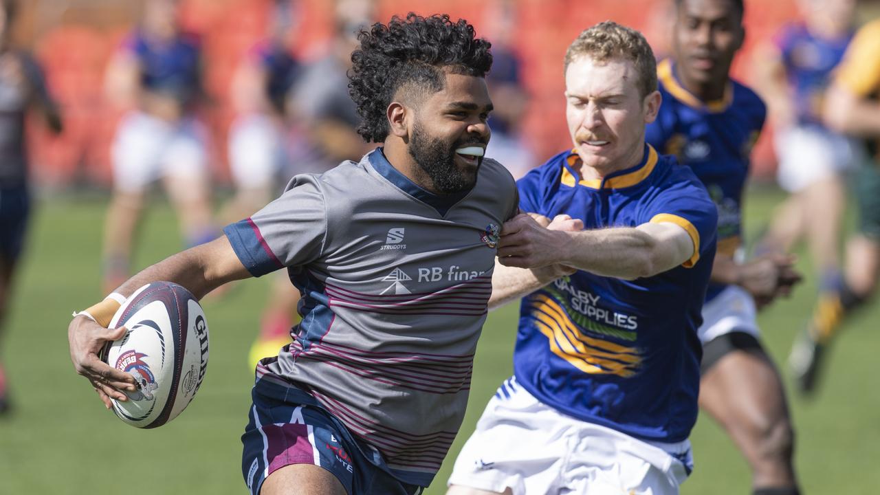 Harrison Murphy (right) makes a tackle for Dalby Wheatman. Picture: Kevin Farmer