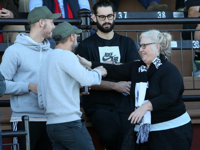 Collingwood ruckman watching Port Adelaide with his mum, Jenn Palmer at Alberton Oval yesterday. Picture: AAP/Emma Brasier