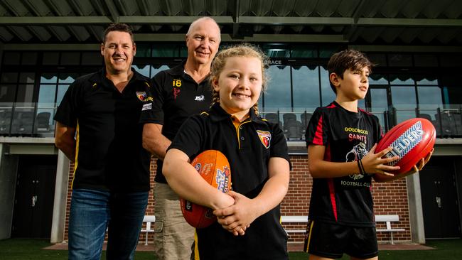 Goodwood Saints president Craig Scott, junior football director Andrew Braley, Holly, 8, and Harrison, 11. The club been named the inaugural Club of the Year for juniors by the SANFL. Picture: Morgan Sette