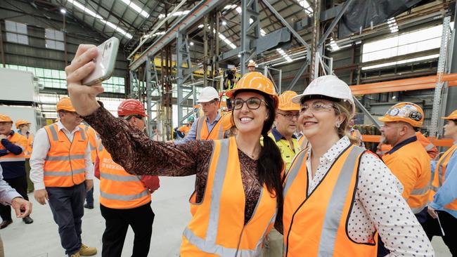 Downer Train Designer Marcela Fantucci Scacchetti takes a selfie with the Premier at the Downer Rail Manufacturing facility at Maryborough. Picture: Lachie Millard