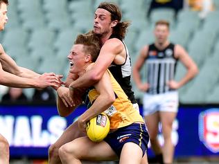 Eagles' Nicholas Hayes is tackled by Port's Jarrod Lienert                  at the SANFL first semi final: Eagles v Port Adelaide at Adelaide Oval.picture: Bianca De Marchi