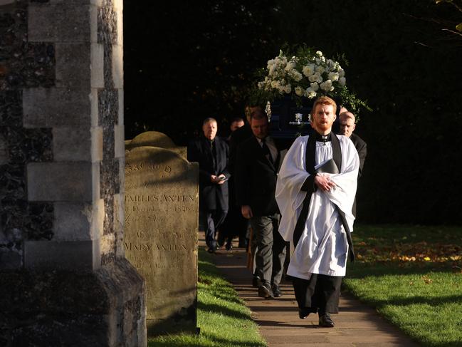 A priest leads the coffin out following the funeral. Picture: Dan Kitwood/Getty Images