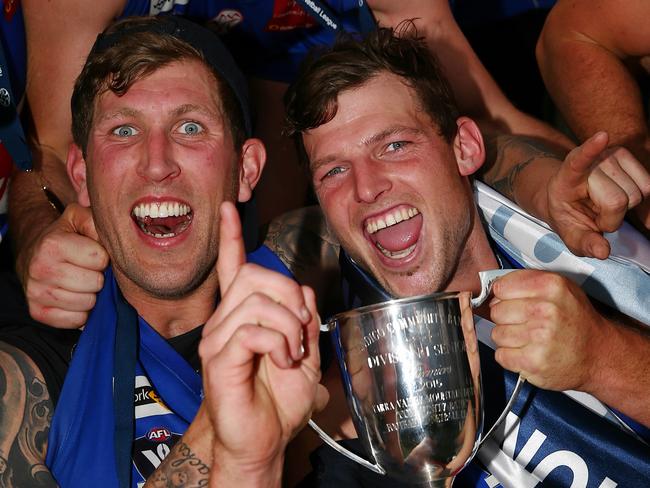 HOLD FOR SUNDAY HERALD SUN- Country football Stars, Wandin star Jarrod Bayliss celebrate's with the trophy and teammate Robbie Ross after there Grand Final win over Healesville  , Healesville. 19th September 2015. Picture: Colleen Petch.