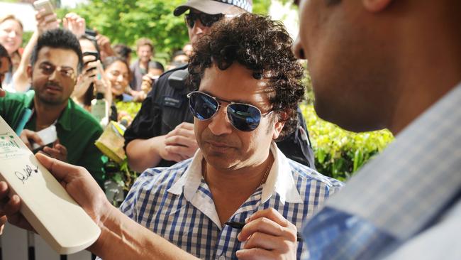 Sachin Tendulkar signs autographs for fans in Bowral.