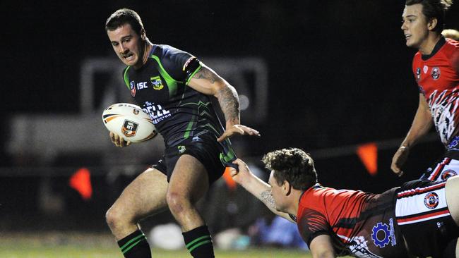 Chris Wishart of the Palmerston Raiders tries to break a lunging tackle by the Bears' Dillan Vanderburg during the NRLNT Men's A Grade match betweem the Litchfield Bears and Palmerston Raiders at Fred's Pass. Pitcure: Felicity Elliott