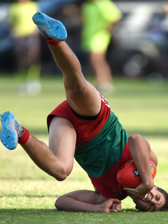 Pines’ Shane Waterstone comes to ground after a successful flying mark. Picture: Jason Sammon