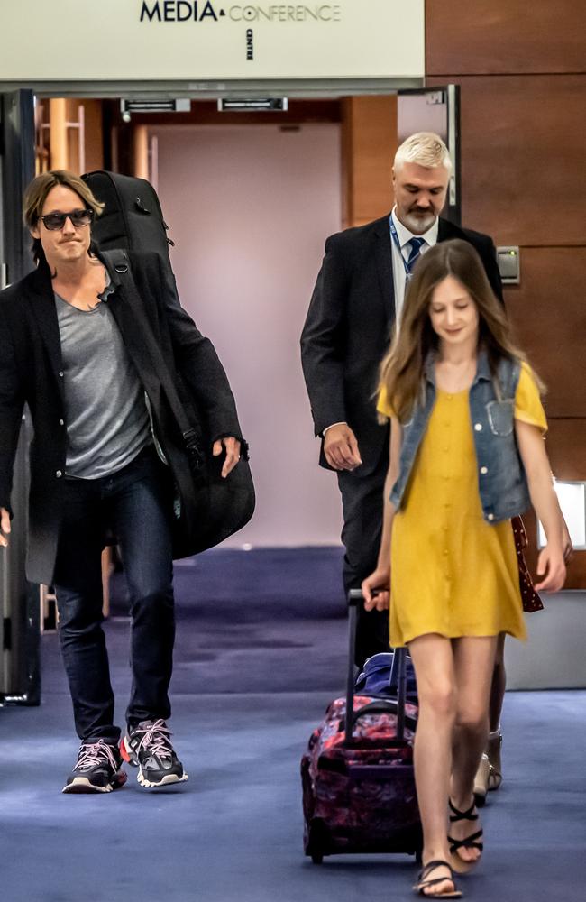 Keith Urban and daughter Sunday Rose pictured at Sydney Airport on Wednesday. Picture: Monique Harmer