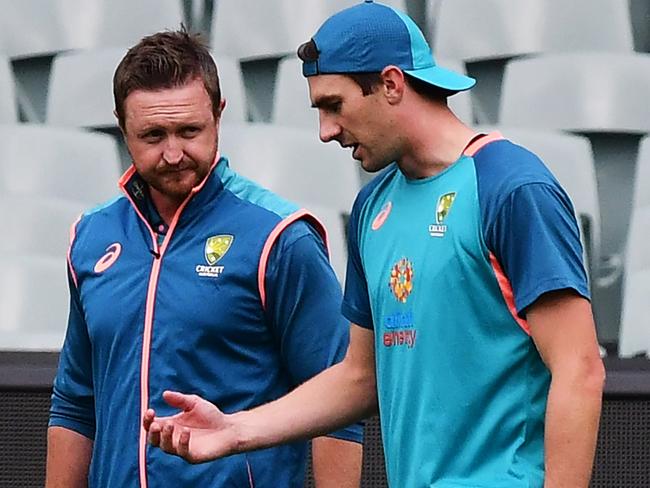 ADELAIDE, AUSTRALIA - DECEMBER 06: Pat Cummins  of Australia chats to team physio Nick Jones during his fitness test during an Australian Test squad training session at Adelaide Oval on December 06, 2022 in Adelaide, Australia. (Photo by Mark Brake/Getty Images)