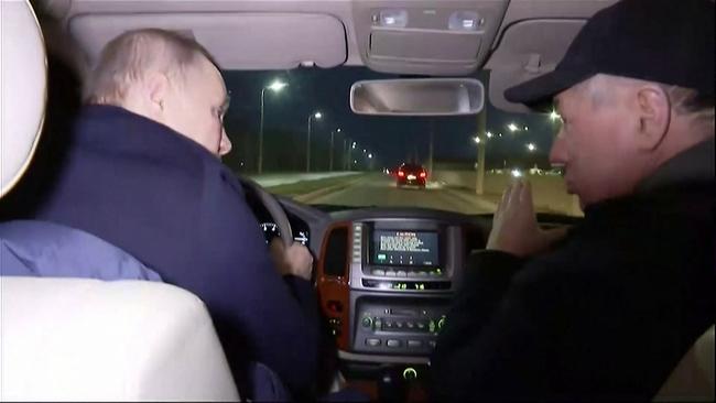 Vladimir Putin drives around the Russian-occupied Ukrainian city of Mariupol with Deputy Prime Minister Marat Khusnullin on Sunday night.