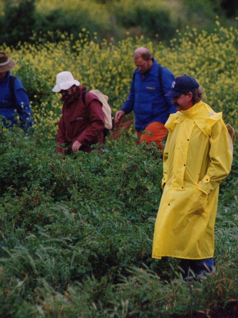 State Emergency Service personnel, volunteers and family members, including Rhianna's father Leon Barreau (blue cap), search the Onkaparinga Gorge area.