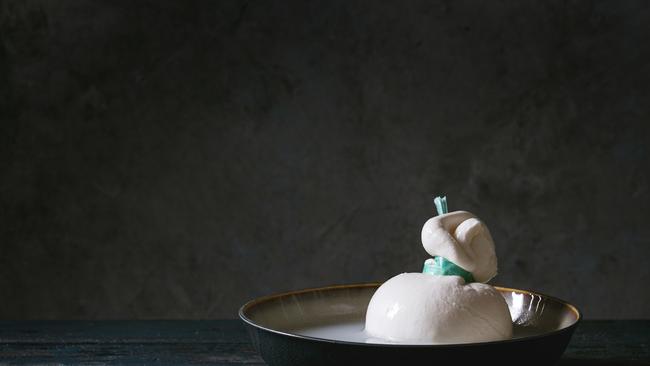 Bowl with whole tied Italian cheese burrata, photo - Natasha Breen