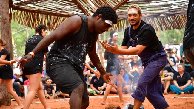 Darwin teenager Tyrell with Youth Forum workshop facilitator Waangenga Blanco performed with fellow Youth Forum Panel members on the closing day of Garma Festival, on Monday August 7. Picture: Zizi Averill