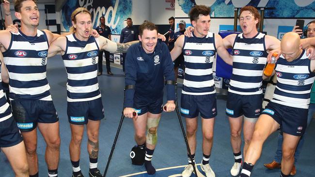 Patrick Dangerfield on crutches celebrates Geelong’s win against Western Bulldogs. Picture: Scott Barbour/Getty Images)