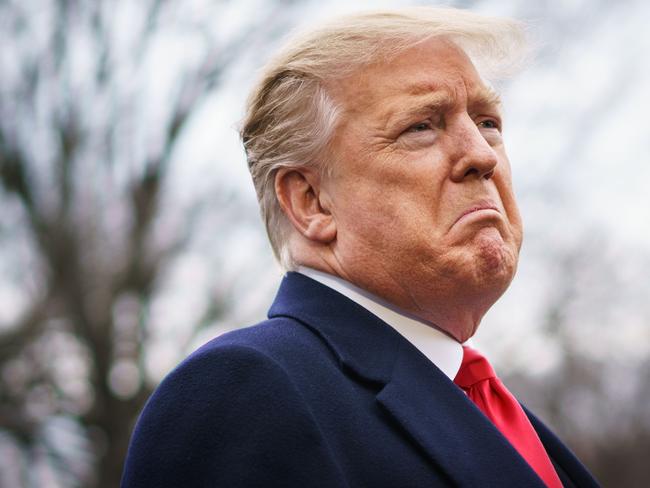 US President Donald Trump speaks to reporters before boarding Marine One on the South Lawn of the White House in Washington today. Picture: AFP 