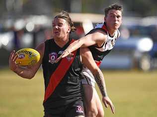 Joshua Patira takes a difficult mark under pressure from Guy Rivett. Picture: Cody Fox