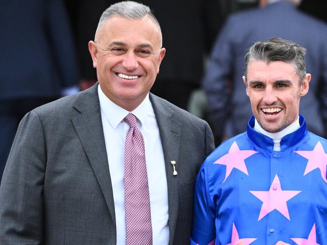 MELBOURNE, AUSTRALIA - AUGUST 03: Billy Egan poses with trainer Dominic Sutton (r)and John Kanga (L) after riding Detroit City to win Race 1, the Tab We're On - Betting Odds during Melbourne Racing at Flemington Racecourse on August 03, 2024 in Melbourne, Australia. (Photo by Vince Caligiuri/Getty Images)