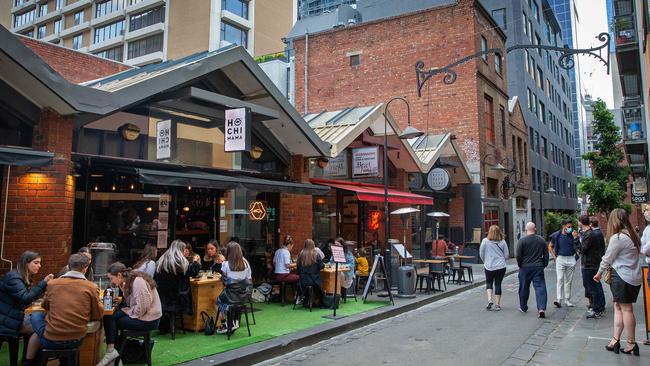 Groups eat out in Melbourne’s CBD after restrictions were lifted. Picture: Mark Stewart