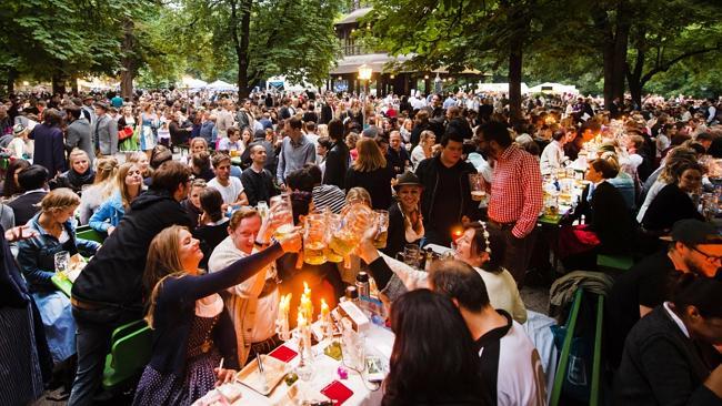 Revellers at the traditional Kocherlballs in a beer garden in Munich’s English Gardens. Picture: Alamy