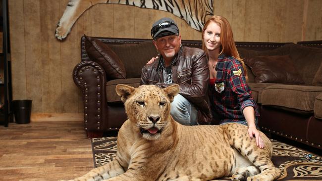 Jeff Lowe and Lauren Dropla with Faith the liliger at their home inside the Greater Wynnewood Exotic Animal Park. PHOTO: Ruaridh Connellan/BarcroftImages/Barcroft Media