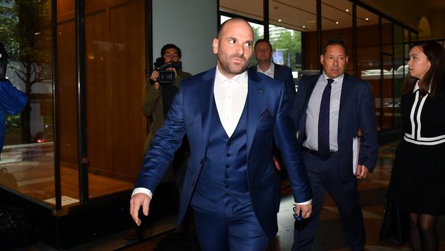 George Calombaris arrives at the Downing Centre court in Sydney.