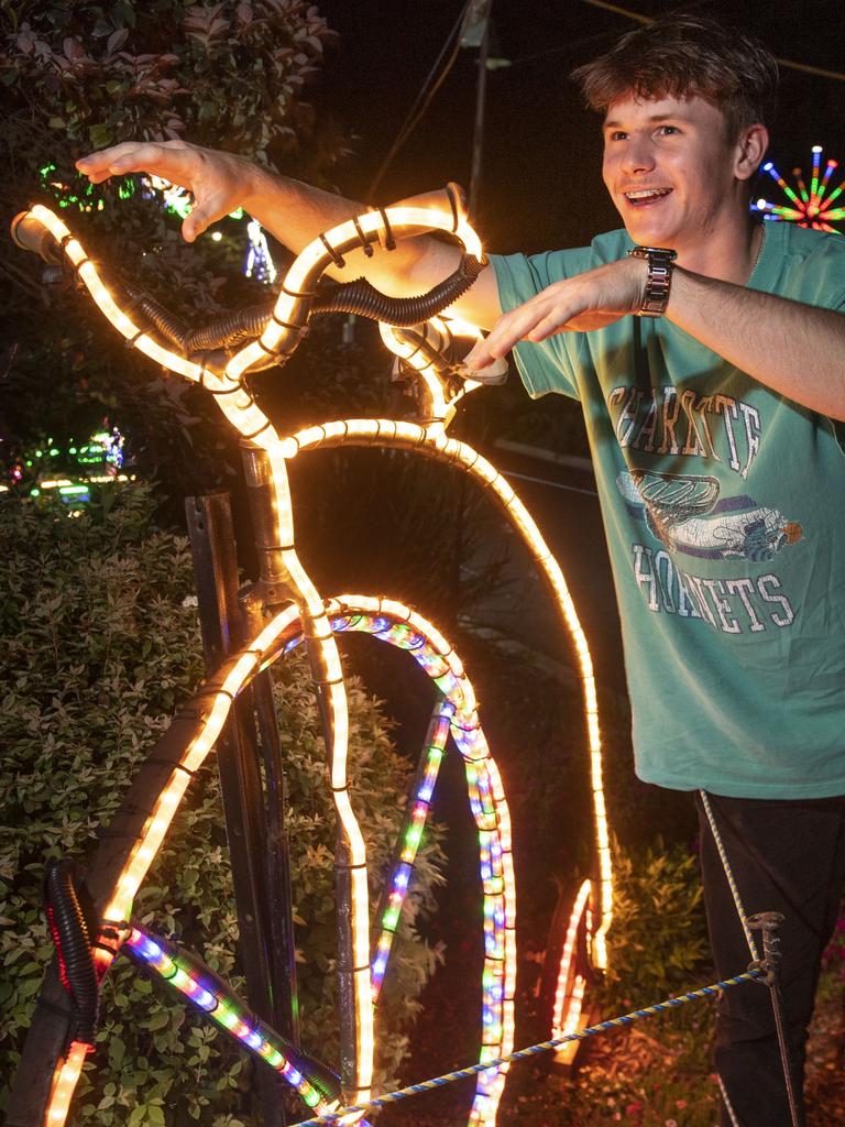 Eli Black tries a penny farthing on for size. Opening of Toowoomba's Christmas Wonderland in Queens Park. Saturday, December 4, 2021. Picture: Nev Madsen.