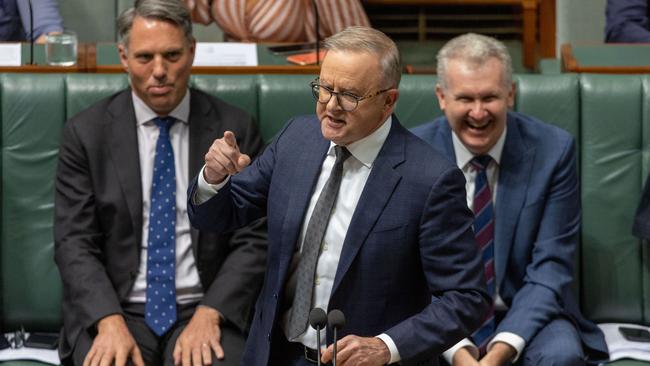 Prime Minister Anthony Albanese makes a point during question time on Tuesday, to the amusement of Richard Marles, left, and Tony Burke. Picture: NCA NewsWire / Gary Ramage