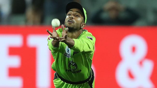 ADELAIDE, AUSTRALIA - FEBRUARY 01: Arjun Nair of the Sydney Thunder takes a catch to dismiss Michael Neser of the Strikers during the Big bash League Finals match between the Adelaide Strikers and the Sydney Thunder at Adelaide Oval on February 01, 2020 in Adelaide, Australia. (Photo by Robert Cianflone/Getty Images)