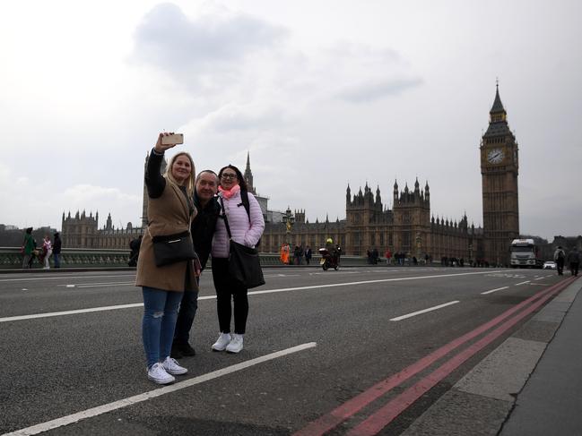 People pose for selfie as they walk over Westminster Bridge as it is opened to the public on March 23, 2017 in London, England. Picture: Getty