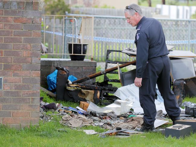 Police and Tasmania Fire Service personnel finish their investigations at the site of the Clarendon Vale house fire, where the body of Michelle Louise Meades was found. Picture: Richard Jupe