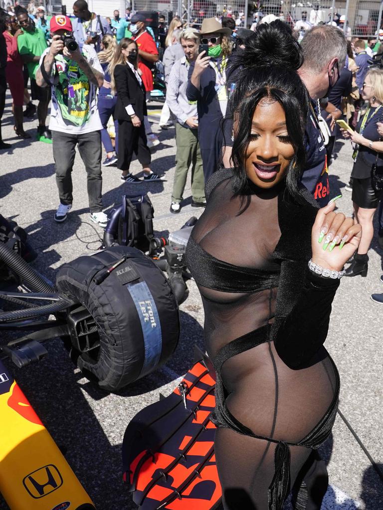 US rapper Megan Thee Stallion looks at the media in the pit lane before the Formula One United States Grand Prix. Photo by Darron Cummings / POOL / AFP.