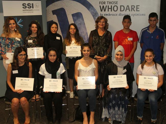 Some of the students with Violet Roumeliotis, CEO of Settlement Services International, after receiving their SSI scholarships in April.