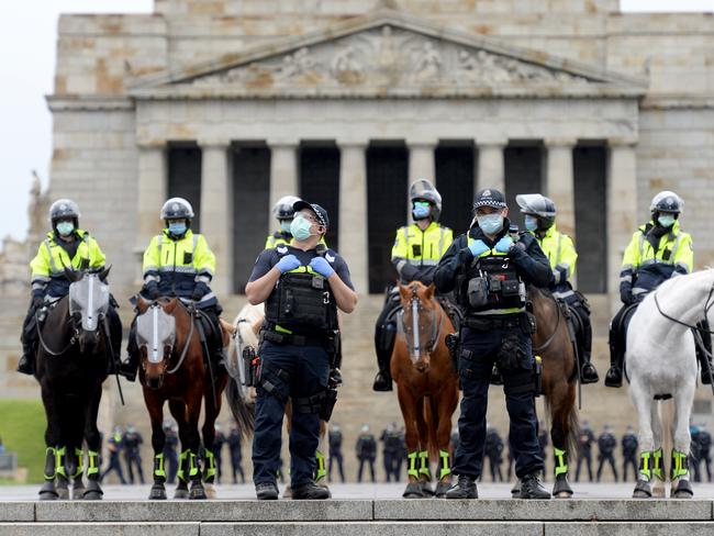 Police turn out in force at the anti-lockdown protest near the Shrine of Remembrance. Picture: Andrew Henshaw