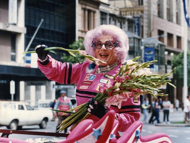 Dame Edna Everage waves during the 1993 parade prior to the Grand Prix in Adelaide. Picture: Barry O’Brien