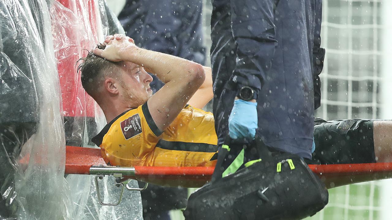 Harry Souttar is stretchered from the field. Picture: Mark Metcalfe/Getty Images