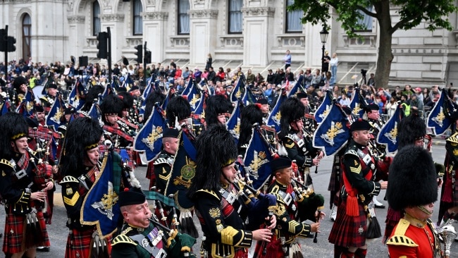 Army, Navy and RAF troops from Britain and the Commonwealth marched around the city with royalists soaking in the action on Sunday. Picture: Jeff J Mitchell/Getty Images