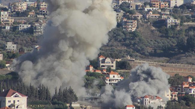 TOPSHOT - Smoke rises from the site of an Israeli airstrike that targeted the southern Lebanese village of Khiam on October 21, 2024. (Photo by AFP)