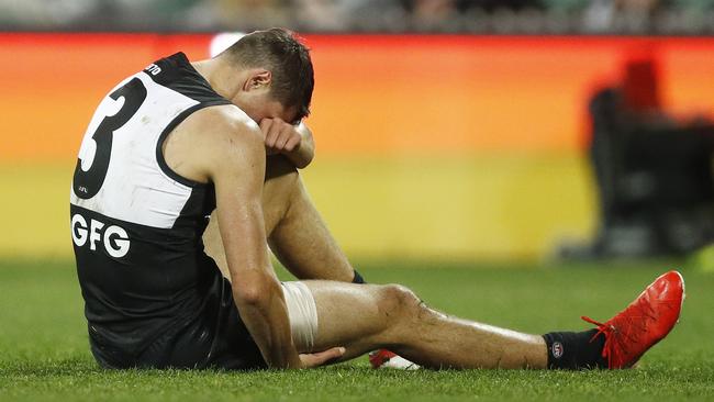 Ryan Burton ripped his hamstring after chasing Charlie Cameron. Picture: Getty Images