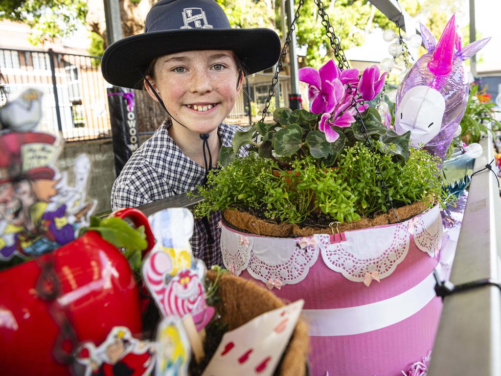 Toowoomba East State School student Grace Simpson with her entry in the school's hanging basket display, Friday, September 13, 2024. Picture: Kevin Farmer